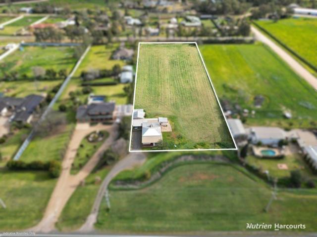 Neat four bedroom home on 2.5 acres ready for your vision