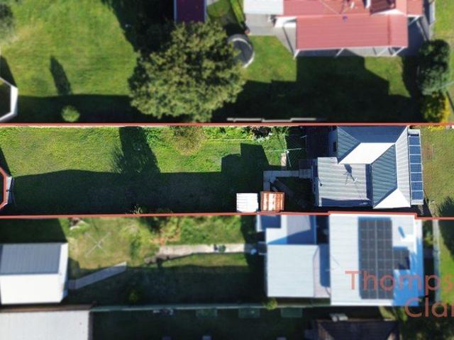 Neat Home with a Great Sized Backyard & Rear Lane Access