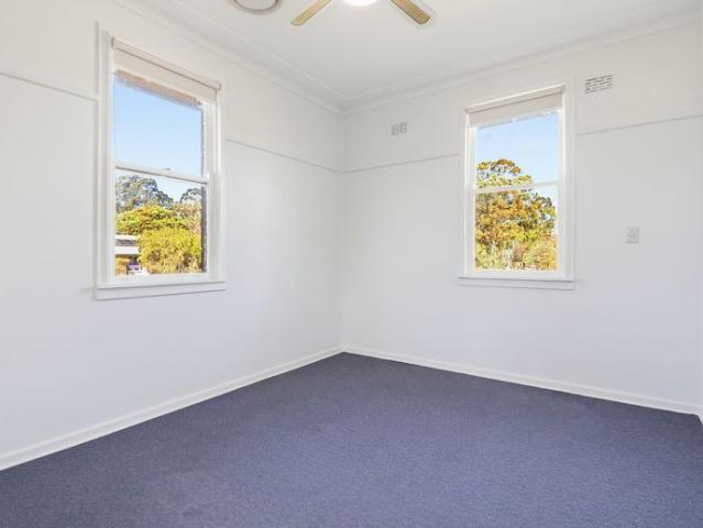 Neat Spacious Two Bedroom Brick Home with Large Backyard