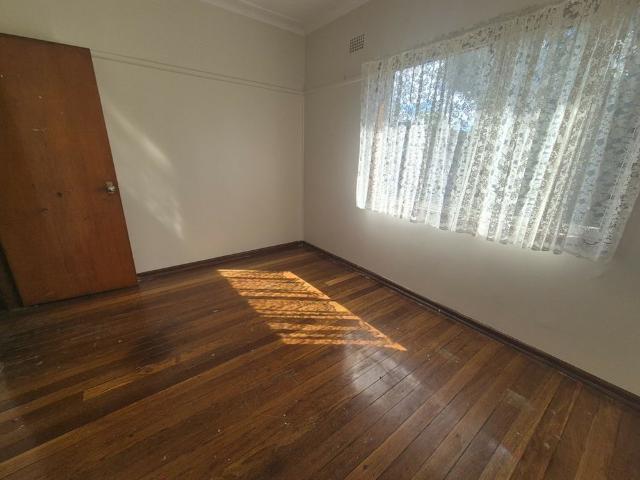 Neat & Tidy 3 Bedroom Home with Spacious Backyard!