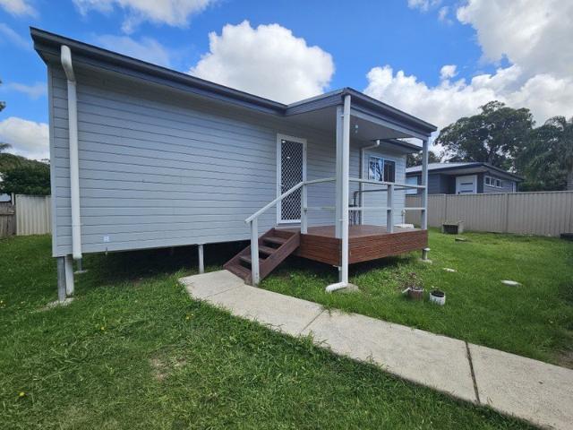NEAT & TIDY HOME WITH DETACHED GARAGE & SPACIOUS YARD