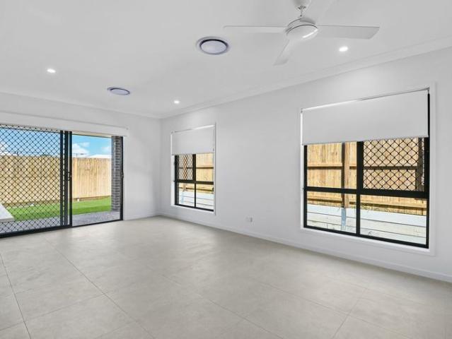 NEAR NEW 4 BEDROOM HOME, 2 LIVING, DUCTED AC LOCATED IN THE VIBRANT FLAGSTONE ESTATE!