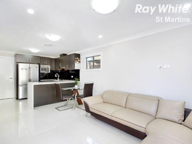 NEAR NEW 4 BEDROOM TOWN HOME WITH DOUBLE GARAGE WALK TO ROOTY HILL TRAIN STATION
