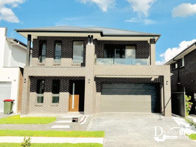 Near New 5 Bedroom Family Home, 4 bathrooms, 3 Kitchens & A Theatre Room Within Walking Distance To Northbourne Public School!