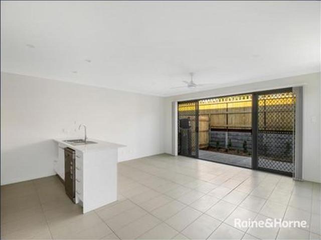 NEAR NEW TOWNHOUSE WITH DOUBLE DRIVEWAY AND SINGLE GARAGE