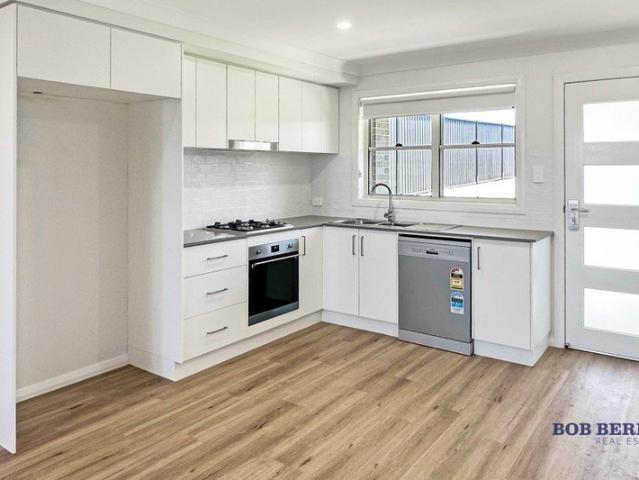 Near New Two Bedroom Duplex with Private Yard