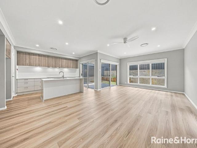 NEAR NEW FAMILY HOME WITH TWO LIVING AREAS!