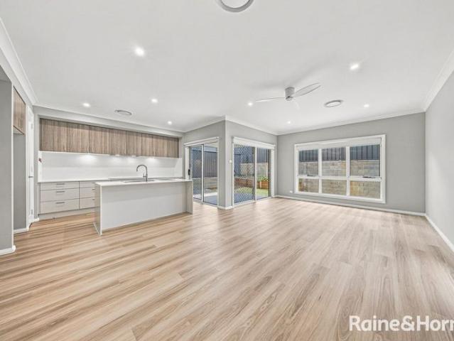 NEAR NEW FAMILY HOME WITH TWO LIVING AREAS!
