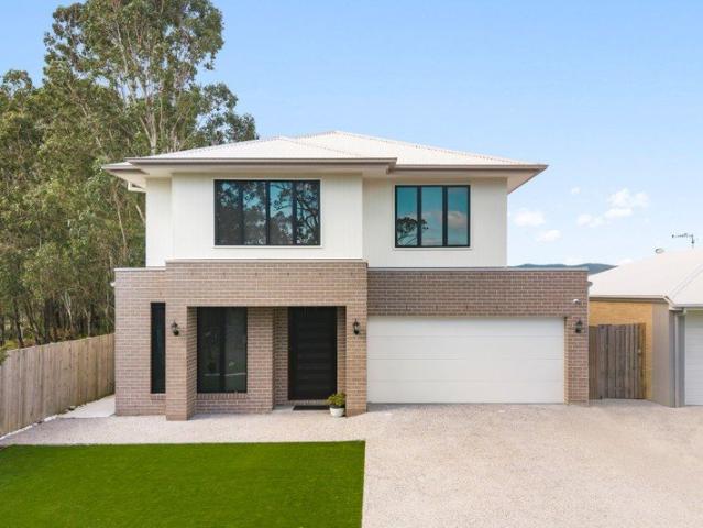 Near New Family Living in the Heart of Logan Village