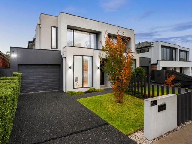 Near New Luxury Living in the Coveted McKinnon Primary & Secondary Zones