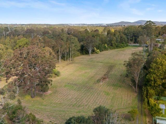 Nearly 11 Acres Backing onto Dora Creek Reserve