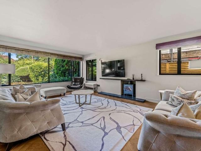 Nestled in a private tree lined road this exceptional detached family home of remarkable quality and architectural distinction