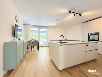 Neuwertige Gartenwohnung mit Keller und Tiefgaragenstellplatz optional