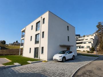 Neubau Gartenwohnung w1 mit Sitzplatz, Privatgarten, Lift, Keller und 1 AEHP