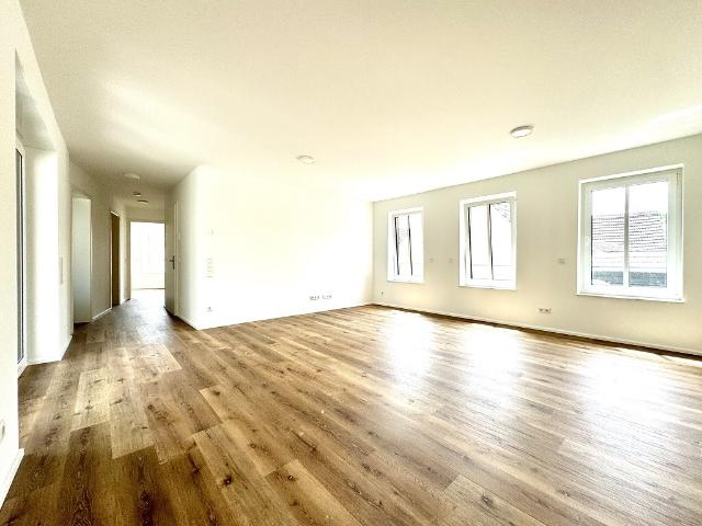 Neubau Erstbezug A+ 3 Zimmer mit Balkon und Garage nahe dem Zentrum