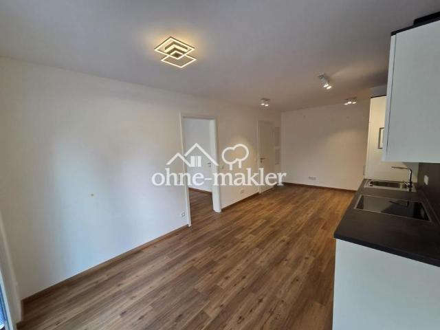 Neubau Erstbezug sofort verfügbar! Exklusive 2 Zi Wohnung mit EBK und Garten sowie Tiefgarage