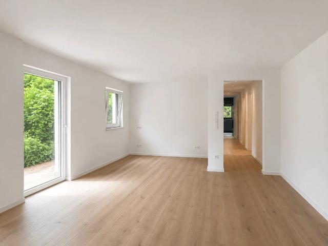 Neubau! 3 Zimmerwohnung im Souterrain mit Terrasse und Garten