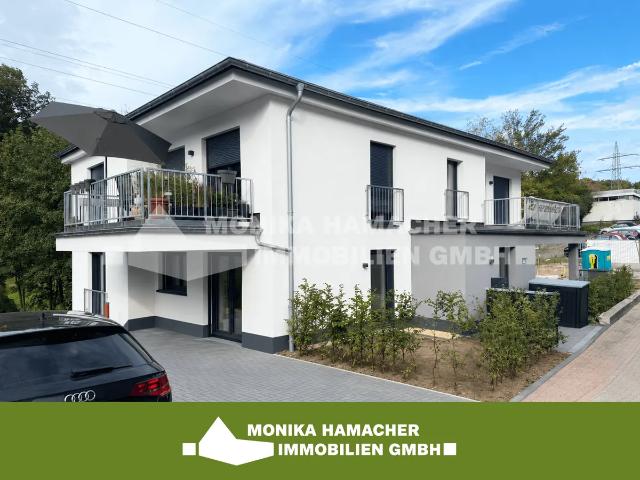 Neubau im Milchborntalweg! 3 Zimmerwohnung im Souterrain mit Terrasse und Garten
