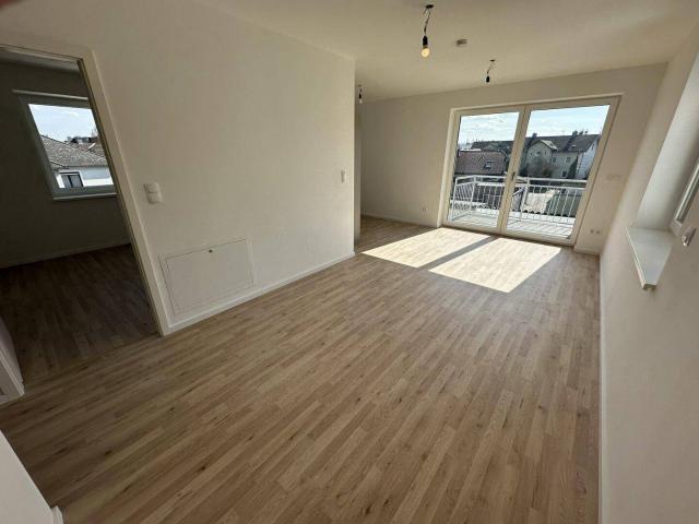 Neubau: Stilvolle Wohnung mit Balkon, Wärmepumpe & Lift Erstbezug!