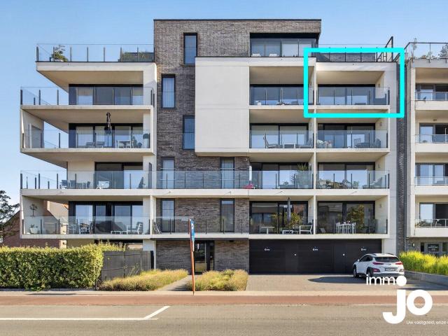 New build two bedroom flat with a sunny terrace and garag.
