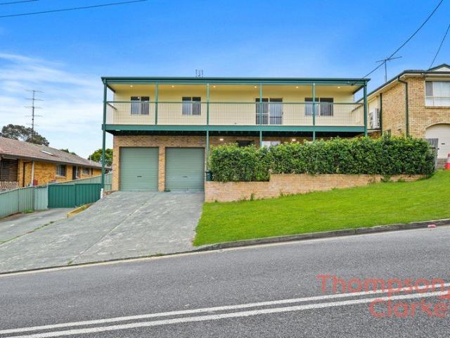 Newley Rebuilt 5 Bedroom Home With Side access, Multiple Sheds & Valley Views!