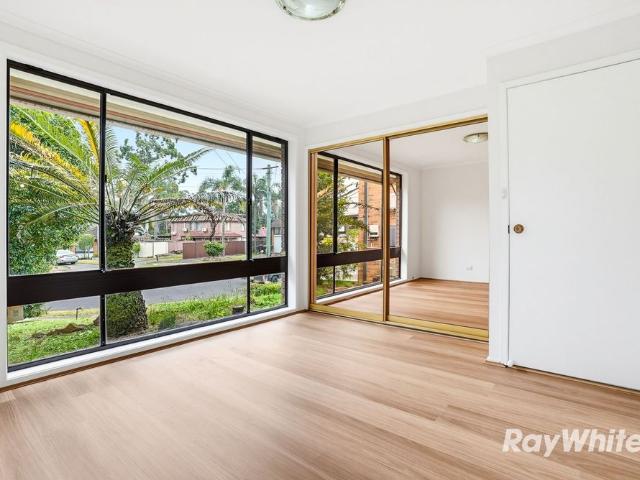 NEWLY UPDATED HOME WITH 2 GARAGES WALK TO STATION & SHOPS