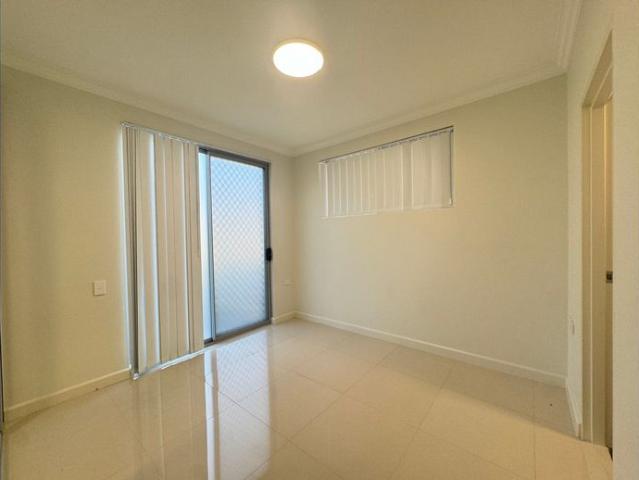 Newly Renovated Ground Floor 2bedrooms with extra lounge room Apartment with Courtyard in Prime Location