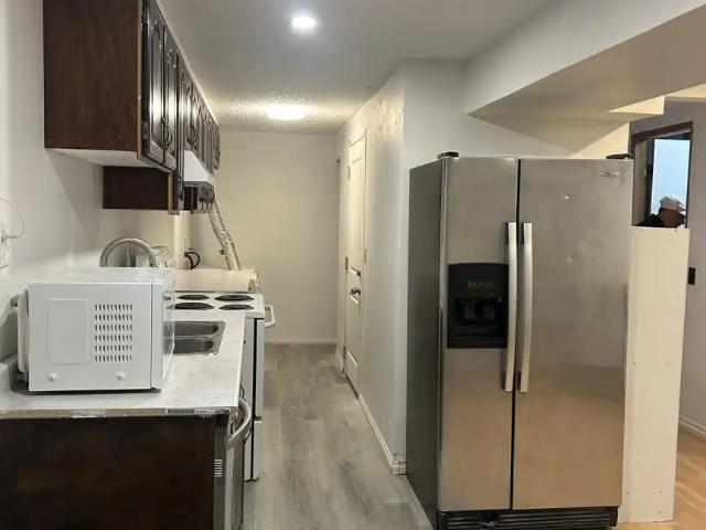 Newly Renovated Legal 2 Bedroom + 1 Den Basement Suite in Beddington Heights