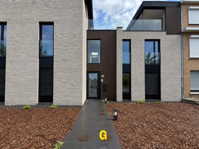 Nieuwbouwappartement met 2 slaapkamers, ruim terras, standplaats en berging te Munsterbilzen Label A
