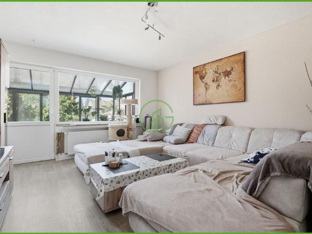 # NIEDERAU # Einfamilienhaus, ca. 138 m², mit Terrasse, großem Garten, Garage und Wintergarten