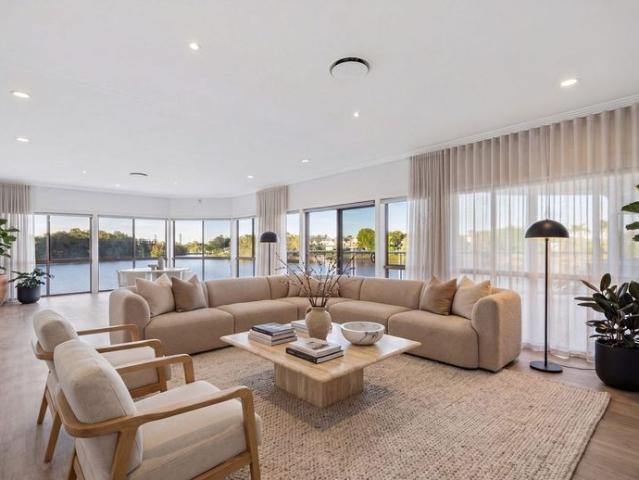 North East Point Position Spacious Waterfront Home with Boat Ramp, Pool & Basement Parking