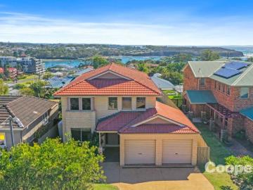 North Facing Coastal Living with Ocean Views & Walk to Town Ease