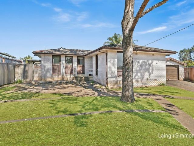 North facing brick home holds potential on an impressive 777sqm level block