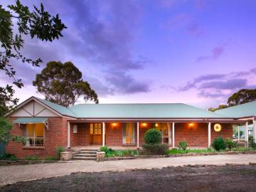 North facing brick Homestead on expansive garden grounds with pool & produce garden