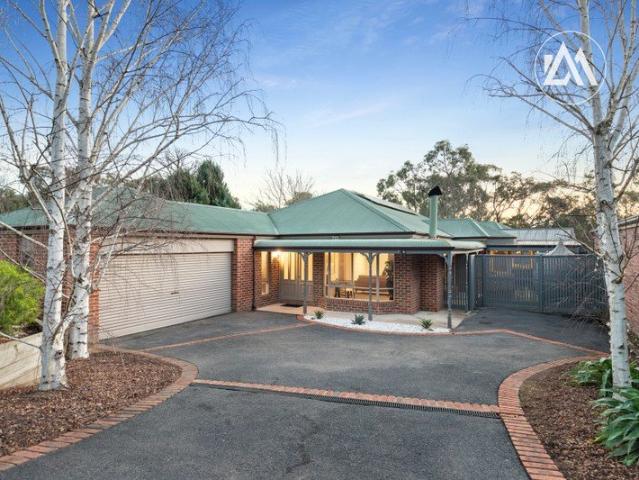 North Facing Family Sanctuary Amidst a Tranquil Woodlands Court Setting