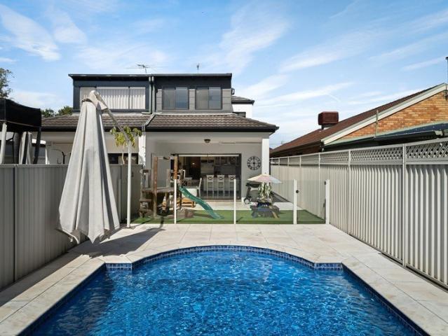 North facing poolside living in a prized bayside pocket