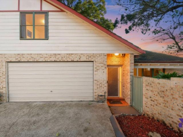 North facing three bedroom townhouse reveals a private garden setting