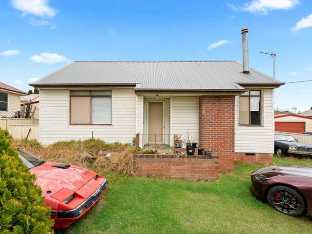 North Facing Two Bedroom Home with Generous Garage & Workshop