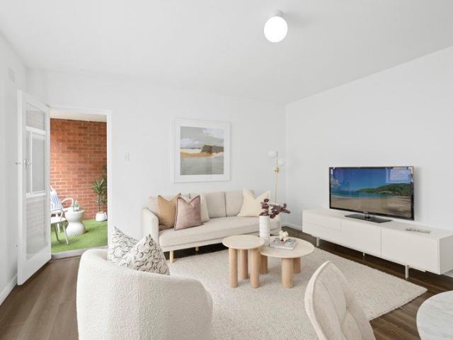 North Facing, Updated Brick Apartment Positioned at Quiet Rear of Block