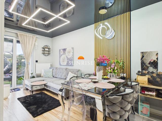 Sprzedam nowoczesny apartament z ogrodem i parkingiem