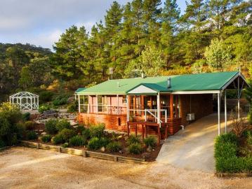 Beautiful off grid acreage with stone cottage