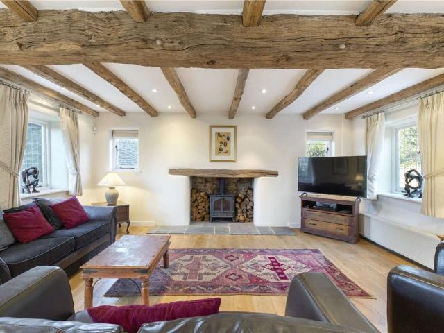 Offered in immaculate condition with space and character in abundance, an outstanding 5 bedroom barn conversion on a half acre plot in the heart of the beautiful village of Gomshall
