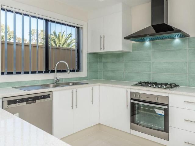 Offering charming character, convenient low maintenance living Four Bedroom Home
