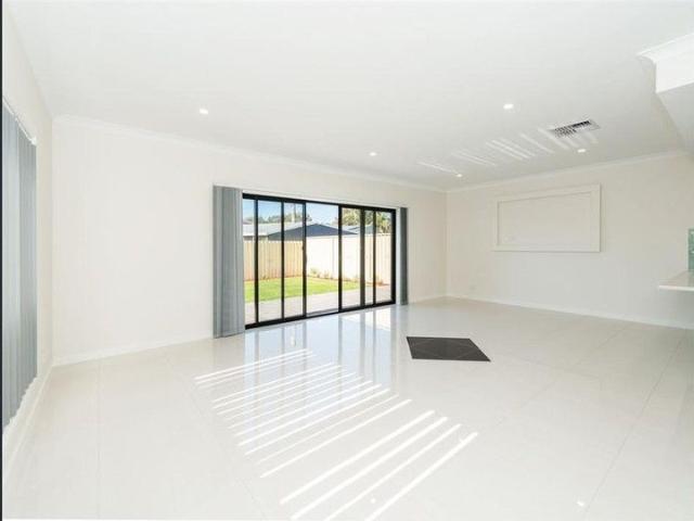 Offering charming character, convenient low maintenance living Four Bedroom Home