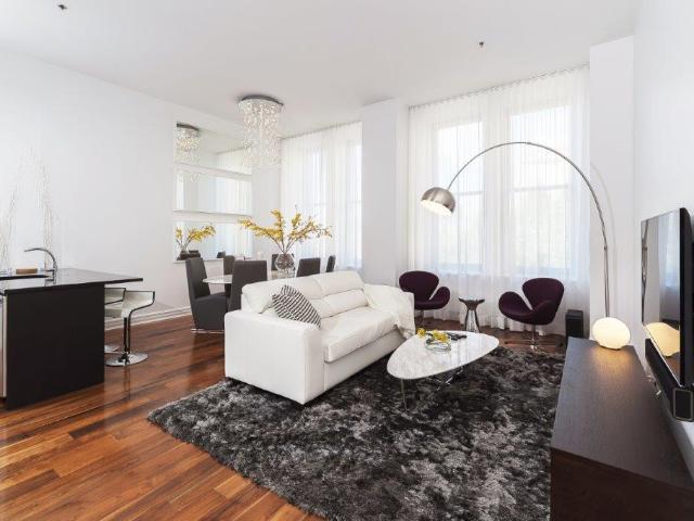 Old Montreal Furnished Condo Rental at Europa Building – Sophisticated 1 Bedroom plus 1 Bathroom with Hardwood Flooring and Spacious Layout