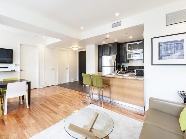 Old Montreal Furnished Condo Rental at Le Themis – Cheerful 1 Bedroom Suite with In suite Laundry and Flat Screen TV