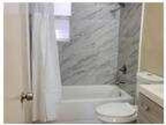 One bedroom unit in fourplex on tree lined street