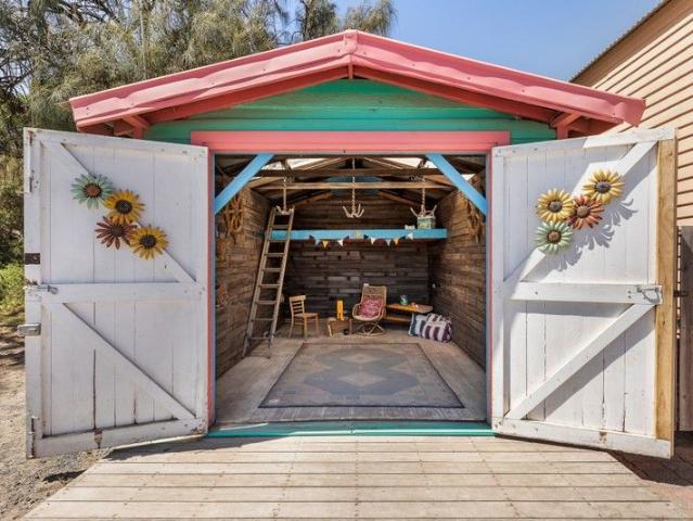 One of a Kind Beachfront Boathouse in Bayside's Premier Coastal Pocket