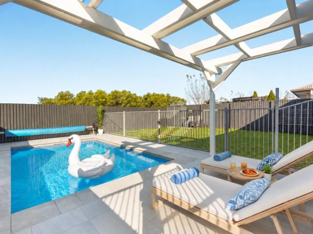 One of Logan Reserve's Best Family Homes Pool, Butler's Pantry & Move In Ready