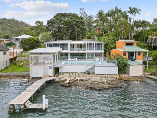 Stunning waterfront home on a double block
